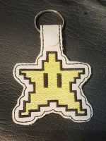 Retro 8-bit video game star keychain